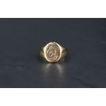 A gent's 9ct gold signet ring bearing monogrammed panel, size R & approx 6.2g