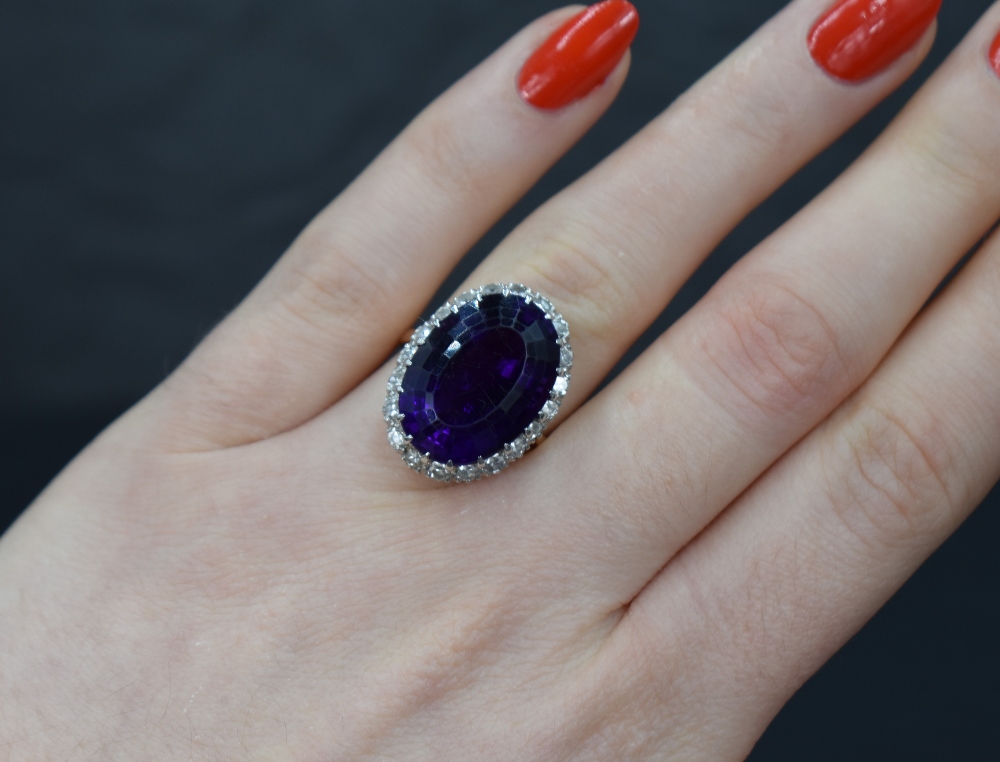 An amethyst and diamond oval cluster ring having large oval amethyst, approx 12ct surrounded by - Image 4 of 4