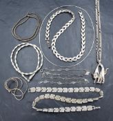 A selection of silver and white metal necklaces and chains including a cat pendant, approx 8 pieces