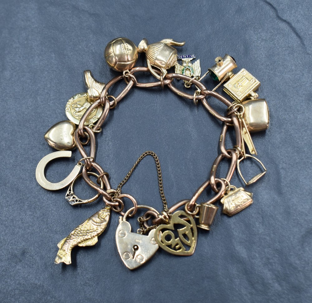 A 9ct gold curb link charm bracelet having seventeen gold charms of various design including a