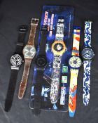 A selection of five Swatch wristwatches including a Blue Conker GE704, a Gessetto GB155, and a