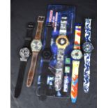 A selection of five Swatch wristwatches including a Blue Conker GE704, a Gessetto GB155, and a