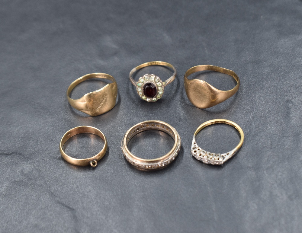 A small selection of 9ct gold and yellow metal rings including signet, eternity, dress style etc,