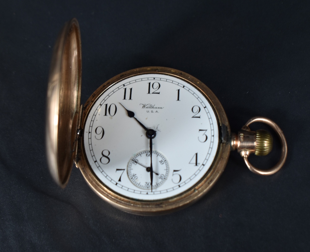 A Waltham U.S.A 9ct gold half hunter top wound pocket watch, the white dial with Arabic numerals and