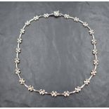 A 9ct white gold necklace having moulded flower and bar links, approx 16' & 19g