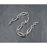 A 9ct white gold bracelet having lozenge shaped plain and textured links, approx 7.5' & 5.6g