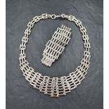 A silver necklace and matching bracelet of multi bar form, both having hook and loop clasps,