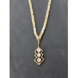 A 9ct gold necklace having three stone diamond drop, total approx 0.192ct in an open mount, with