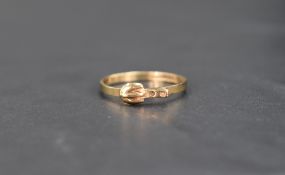 A 9ct gold band ring modelled as a buckled belt, size L & approx 1g