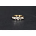 A five stone graduated old cut diamond ring, total approx 1.25ct in a claw set mount on a yellow