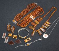 A selection of modern Baltic Amber jewellery including silver pendants, bangle, multi bead