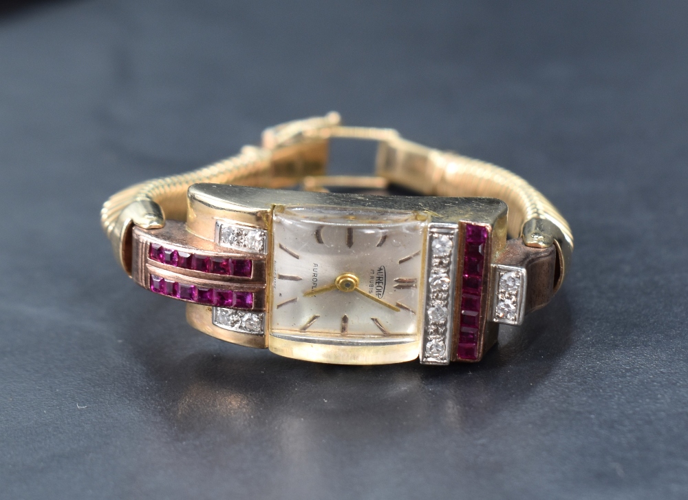 A 9ct gold cocktail watch by Aureole having baton numeral dial to rectangular face with convex glass