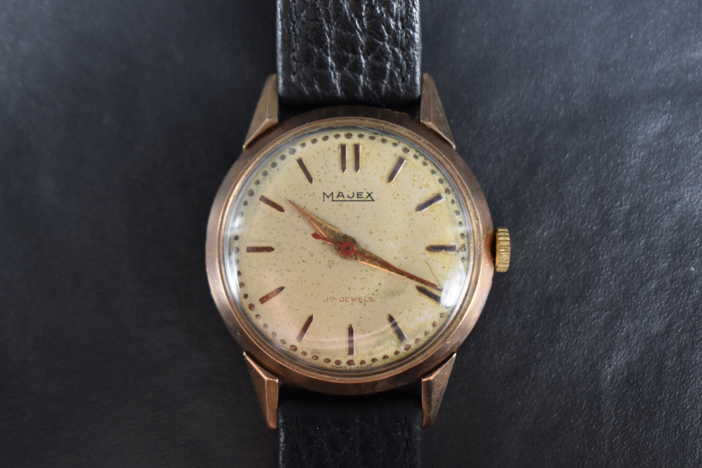 A nine carat gold cased Majex wristwatch, the champagne dial with baton five minute markers and bead