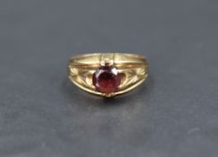 A gent's 9ct gold garnet set gypsy ring having engraving to shoulders, size V & approx 6.2g