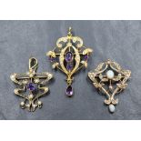 Three Edwardian yellow metal pendants, all stamped 9ct and having seed pearl decoration, two with