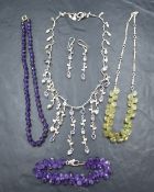 A silver necklace with matching earrings by Dower & Hall having multi semi precious stone set drops,