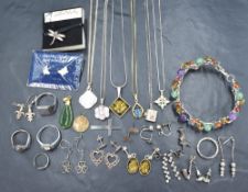 A small selection of silver and white metal jewellery including pendants including Milenium &