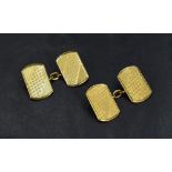 A pair of 18ct gold cufflinks of rectangular form with decorative engraving, 6.9g