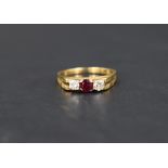 A diamond and ruby trilogy ring having three equal stones, each approx 0.128ct in a claw set mount