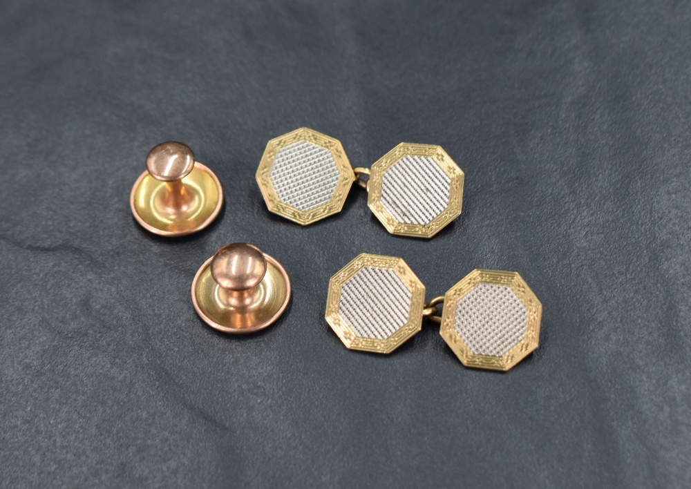 A pair of 18ct and 9ct gold cufflinks of octagonal form having a central white gold octagon with a