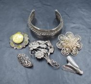A small selection of white metal brooches including Scottish silver freen agate, filligree, Danish