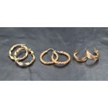 Three pairs of 9ct gold hoop earrings, two pairs of a twisted design and a pair of half-circle studs