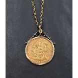 A gold half sovereign dated 1909 in a 9ct gold removable decorative pendant mount on a 9ct gold