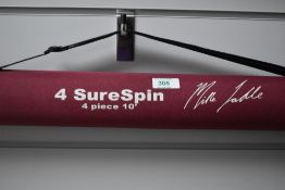 A Sure Spin 4pc 10ft spinning rod by Mike Ladle in soft and hard original cases