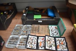 A Large collection of trout flies in 15 pocket boxes and a wallet