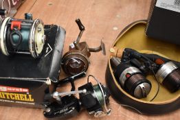 A Shimano Bio master 3500 with spare spool and two vintage spinning reels a garcia mitchell 301