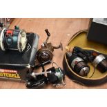 A Shimano Bio master 3500 with spare spool and two vintage spinning reels a garcia mitchell 301