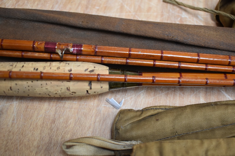 Two unmarked split cane fly rods a 3pc 9ft 2in and a 3pc 10ft 9in with shorter spare tip