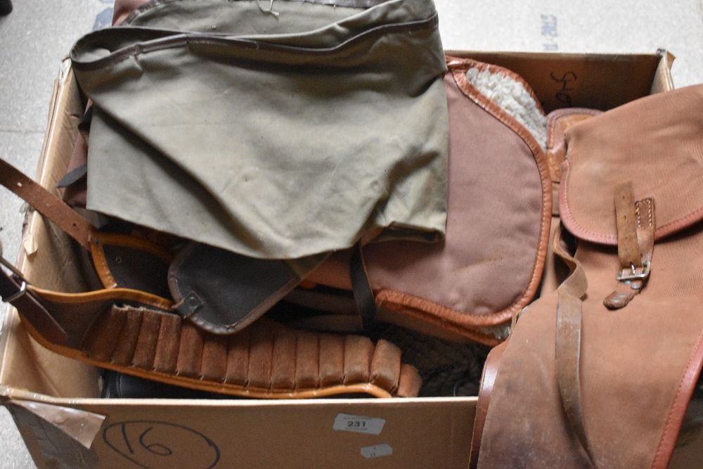 A box containing six vintage gun sleeves an old game bag and a cartridge belt