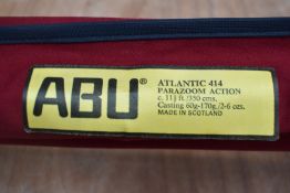 An Abu Garcia Atlantic 414 parazoom action 2pc 11ft 6in beech caster rod in original sleeve