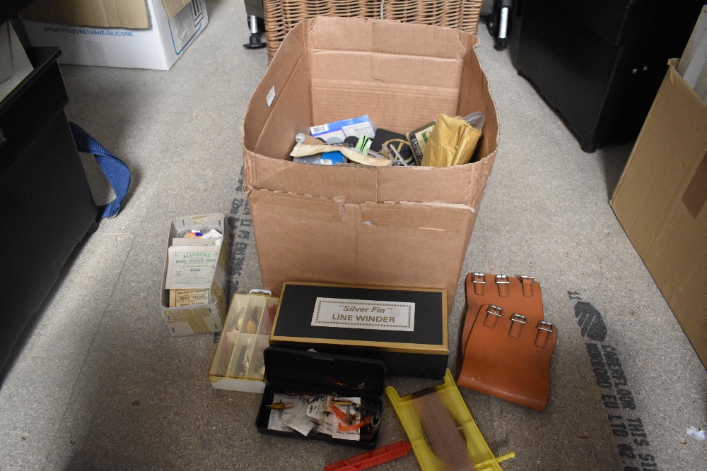 A box of mixed fishing tackle and rig components and a silver fin line winder in original box