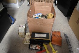 A box of mixed fishing tackle and rig components and a silver fin line winder in original box