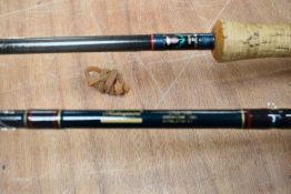 Three fly fishing rods A Daiwa Graphite trout 2pc 10ft #7-9 and a Shakespeare radial carbon 2pc 10ft