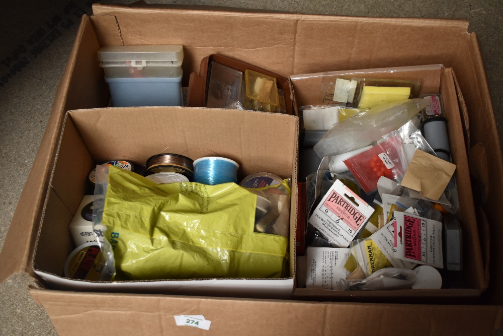 A large box containing hooks, line and some lures