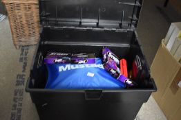A black fishing tackle seat box containing lots of tackle from floats,Rigs ,line and lures