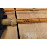 four Fishing rods An unmarked 3pc vintage cane rod A 2pc 7ft 6in graphite fly rod and a Ryobi 2pc