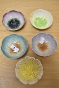 Five modern floral shaped sundea bowls.