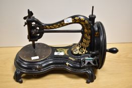 A Victorian swan necked Jones sewing machine, measuring 40cm long