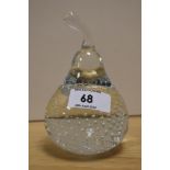 A 20th Century clear or Flint art glass paperweight, in the form of a pear with controlled bubble