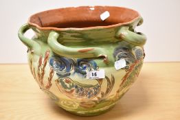 A late 19th early 20th century Brannam Pottery planter, of rustic form, with abstract fish and