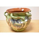 A late 19th early 20th century Brannam Pottery planter, of rustic form, with abstract fish and