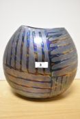 A Substantial Poole Pottery vase, having iridescent horizontal and vertical design.