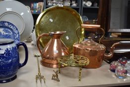 A selection of assorted brass and copper including kettle, trivet and jug.