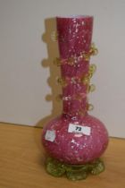 A 20th Century pink cased spangled glass vase, measuring 25cm tall
