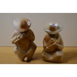 Two hand made Mexican figural ornaments of mother and child and musician, the largest measures