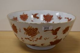 A large Oriental bowl having bird and foliage decoration and gilt rim. 30cm diameter.